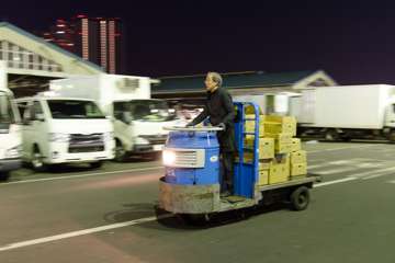 At the Tsukiji Fish Market, they move inventory using these tiny electric trucks!