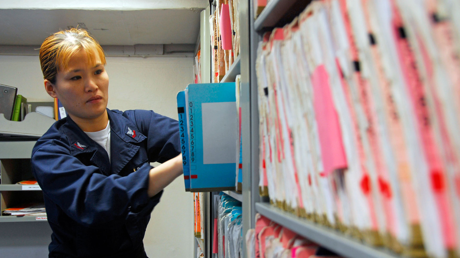 Wall of folders with documents